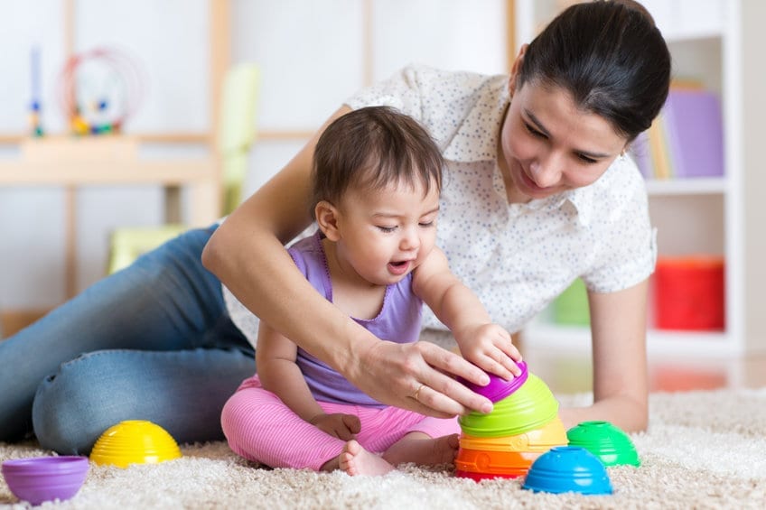 Mom playing with her daughter while in substance use treatment program